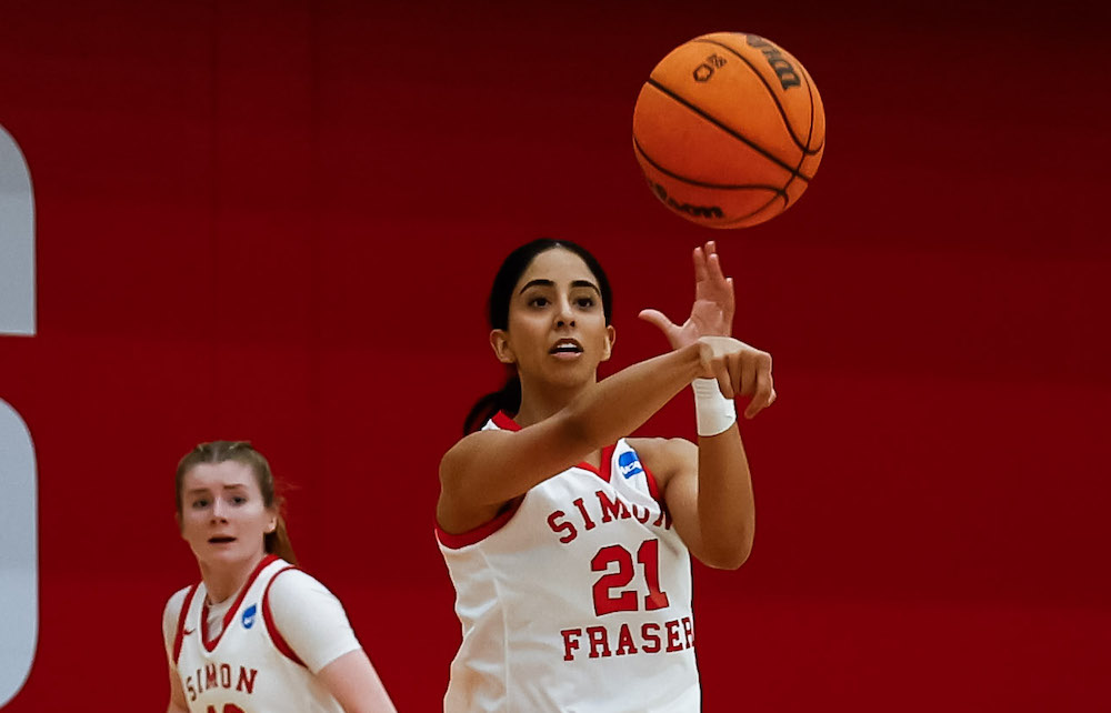 SFU Red Leafs' guard Aram Dulai (right) with former teammate Sophie Klassen during the 2022-23 season. (Photo by Gordon Kalisch property of FastTrackSportsPhotography and SFU athletics 2024. All Rights Reserved)